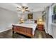 Cozy bedroom featuring a ceiling fan, hardwood floors, and a window with natural light at 202 Brook Ln, Durham, NC 27712