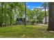Charming two-story home with a well-manicured lawn and a covered seating area at 202 Brook Ln, Durham, NC 27712