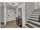 Inviting foyer with hardwood floors, statement furniture and entry to the home's upper level at 202 Brook Ln, Durham, NC 27712