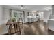 Open-concept kitchen and dining area with hardwood floors and ample natural light at 202 Brook Ln, Durham, NC 27712