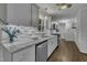 Beautiful kitchen with white cabinets, stainless appliances, and granite countertops at 202 Brook Ln, Durham, NC 27712
