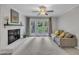 Cozy living room featuring a white brick fireplace and access to the outdoors at 202 Brook Ln, Durham, NC 27712