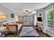 Cozy living room featuring custom bookshelves and bright, natural lighting at 202 Brook Ln, Durham, NC 27712