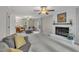 Spacious living room with a white brick fireplace and comfortable seating at 202 Brook Ln, Durham, NC 27712