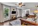 Stylish living room with hardwood floors, large windows, and comfortable seating at 202 Brook Ln, Durham, NC 27712