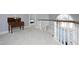 Hallway with white staircase and large window and a view into another bedroom, offering natural light at 203 Edinburgh Dr # C, Cary, NC 27511