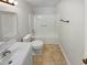 A clean and simple bathroom with a tub and shower combination at 205 Dwelling Pl, Knightdale, NC 27545
