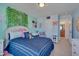 Well-lit bedroom with natural lighting, comfy bed, and decorative wall art at 211 Brier Crossings Loop, Durham, NC 27703