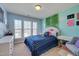 Bright bedroom with natural lighting, and green accent decor at 211 Brier Crossings Loop, Durham, NC 27703