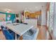 Open dining area connecting to a kitchen and living room, with modern table and chairs at 211 Brier Crossings Loop, Durham, NC 27703