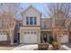 Charming townhome featuring an attached garage, neutral siding, and a well-maintained front lawn at 211 Brier Crossings Loop, Durham, NC 27703
