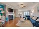Cozy living room featuring a fireplace, modern furniture, and hardwood floors at 211 Brier Crossings Loop, Durham, NC 27703