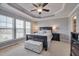 Comfortable main bedroom featuring a tray ceiling, neutral colors, and natural light at 211 Brier Crossings Loop, Durham, NC 27703