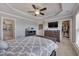 Spacious main bedroom features a tray ceiling, ceiling fan, and closet with ample space at 211 Brier Crossings Loop, Durham, NC 27703