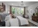 Airy bedroom with large windows offering nature views, neutral colors, and contemporary design at 2112 Opulent Oaks Ln # 7, Durham, NC 27713