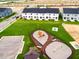 Aerial view of the community, showcasing playground, green spaces and modern townhomes at 26 Twin Birch Dr, Angier, NC 27501
