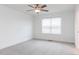 Bedroom featuring a ceiling fan, neutral carpet, natural light, and white trim at 26 Twin Birch Dr, Angier, NC 27501