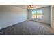 Cozy bedroom with plush carpeting and a large window, offering comfort and natural light at 26 Twin Birch Dr, Angier, NC 27501
