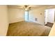 Bedroom featuring plush carpet, a ceiling fan, and an en-suite bathroom, creating a private retreat at 26 Twin Birch Dr, Angier, NC 27501