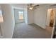 Cozy bedroom with plush carpet and a window overlooking outdoors at 26 Twin Birch Dr, Angier, NC 27501