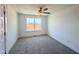 Inviting bedroom with a ceiling fan and large window providing plenty of natural light at 26 Twin Birch Dr, Angier, NC 27501