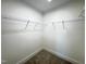 Walk-in closet with carpet flooring and shelving installed at 26 Twin Birch Dr, Angier, NC 27501