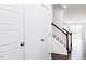 Stairwell and open-concept living space beyond at 26 Twin Birch Dr, Angier, NC 27501