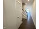 Entry hall with wood floors, stairs, and open floor plan leading to the great room at 26 Twin Birch Dr, Angier, NC 27501