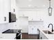 Bright kitchen featuring white cabinetry, stainless appliances, and modern countertops at 26 Twin Birch Dr, Angier, NC 27501