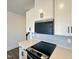 Modern kitchen featuring stainless steel appliances, quartz countertops, and stylish backsplash at 26 Twin Birch Dr, Angier, NC 27501
