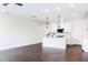 Spacious living room featuring dark wood floors and an open floor plan with kitchen at 26 Twin Birch Dr, Angier, NC 27501