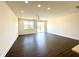 Spacious living room with wood floors, recessed lighting, ceiling fan, and large sliding doors for lots of natural light at 26 Twin Birch Dr, Angier, NC 27501