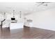 Spacious living room with dark wood floors, open to kitchen with white cabinets at 26 Twin Birch Dr, Angier, NC 27501