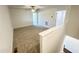 Open loft area featuring neutral carpet and multiple doorways for an airy feel at 26 Twin Birch Dr, Angier, NC 27501