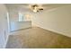 Versatile loft space with plush carpet, ideal for a home office, playroom, or relaxation area at 26 Twin Birch Dr, Angier, NC 27501
