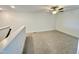 Versatile loft space with plush carpet, ideal for a home office, playroom, or relaxation area at 26 Twin Birch Dr, Angier, NC 27501