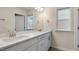 A bright bathroom with double sinks, white cabinetry, and plenty of counter space at 261 Umstead St, Sanford, NC 27330