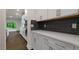 Modern kitchen with white cabinets, stylish backsplash, and stainless steel appliances at 261 Umstead St, Sanford, NC 27330