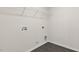A well-equipped laundry room featuring tile floors, a utility sink, and convenient washer/dryer hookups at 261 Umstead St, Sanford, NC 27330