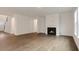Open living room featuring hardwood style floors, a fireplace, and an open concept layout at 261 Umstead St, Sanford, NC 27330