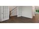 Spacious living room with rich wood flooring, a staircase and bright light filled interior at 261 Umstead St, Sanford, NC 27330