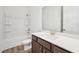 Bathroom featuring a modern vanity with quartz countertops, tub, and shower at 273 Marvel Dr # 139, Rolesville, NC 27571