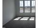 Bedroom with natural light coming through three windows at 273 Marvel Dr # 139, Rolesville, NC 27571