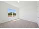Bedroom featuring neutral carpet, ample natural light, and view at 273 Marvel Dr # 139, Rolesville, NC 27571