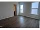 Bedroom with luxury vinyl flooring and natural light coming through two windows at 273 Marvel Dr # 139, Rolesville, NC 27571