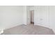 Bedroom featuring neutral carpet, closet, and ample natural light at 273 Marvel Dr # 139, Rolesville, NC 27571