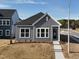 Charming home featuring gray siding, white trim, well-manicured lawn, and a welcoming walkway at 273 Marvel Dr # 139, Rolesville, NC 27571