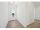 Bright foyer with wood-look flooring and a view of the outdoors through the glass-paneled front door at 273 Marvel Dr # 139, Rolesville, NC 27571