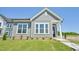 Charming gray home featuring a well-manicured lawn, a tidy garden and large windows that offers lots of natural light at 273 Marvel Dr # 139, Rolesville, NC 27571