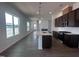 An open-concept kitchen featuring a stylish island, stainless steel appliances, and hardwood floors at 273 Marvel Dr # 139, Rolesville, NC 27571